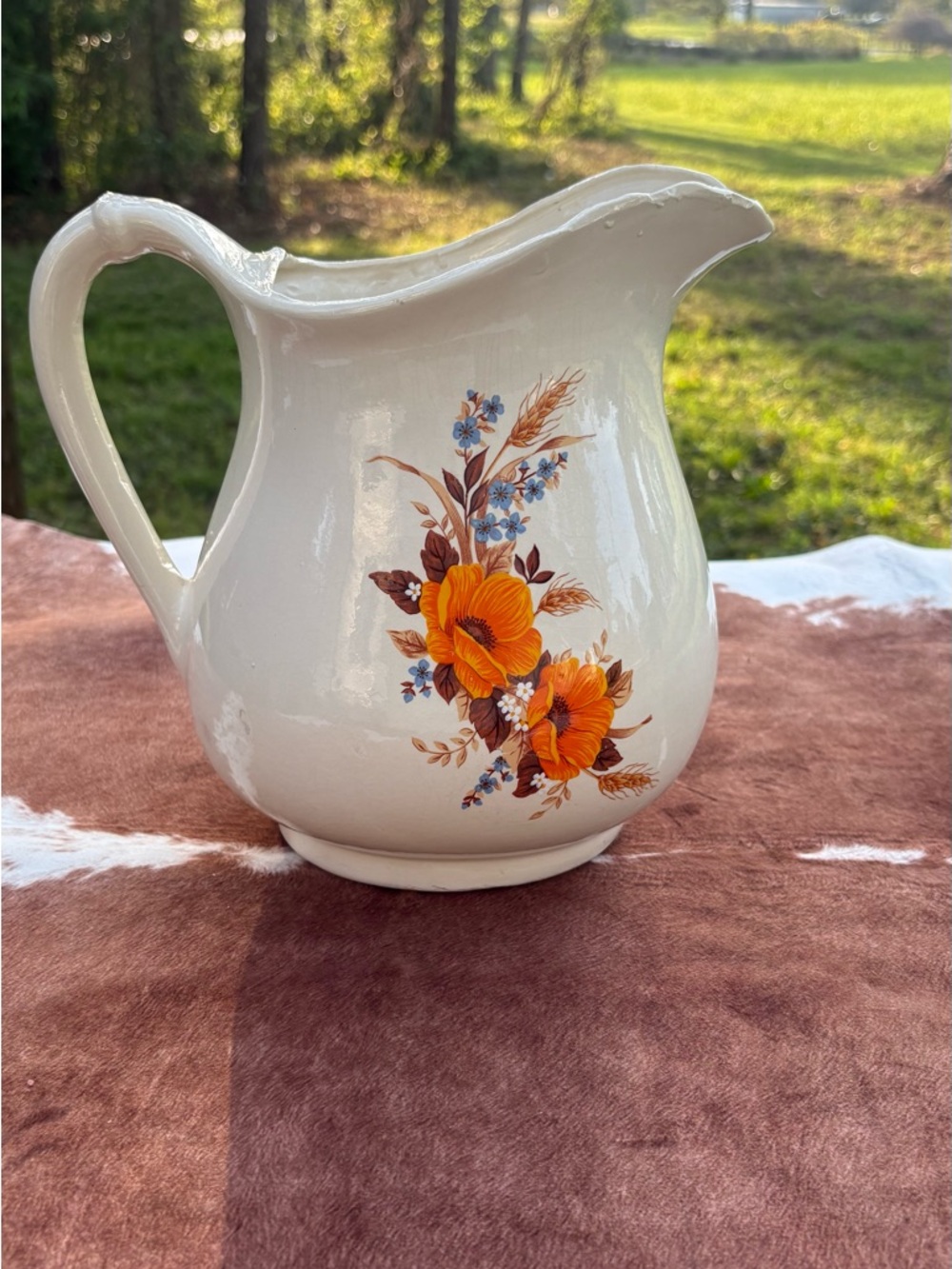 White Ceramic Floral Pitcher with Orange Blooms